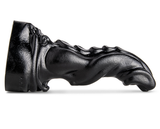 Scimitar Fantasy Dildo by Mr. Hankey’s Toys laying flat, showcasing its scaled back texture and curved design.