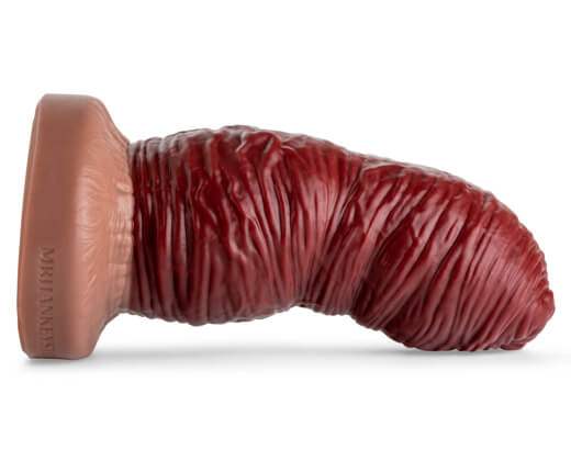Laying horizontally with natural tan base and blood-red shaft, showcasing the HungerFF split color design with extreme lifecast realism