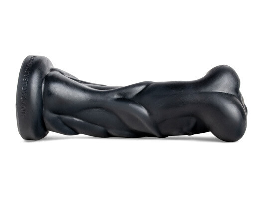 Kalib monster dildo lying flat, emphasizing handcrafted spiral design for deep, unpredictable sensation.